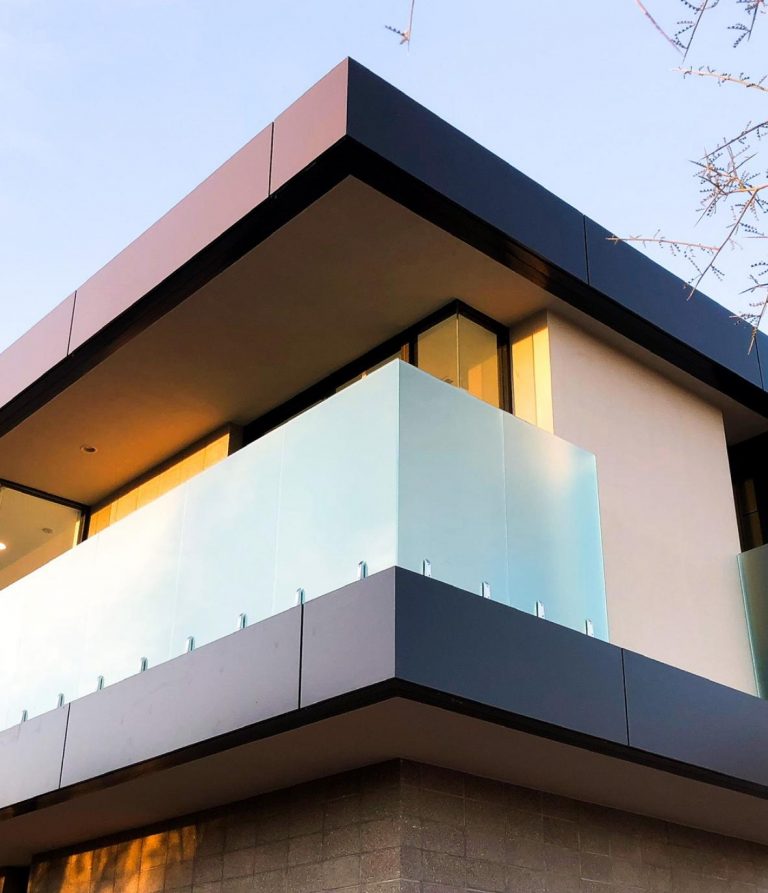Custom frosted glass railing on the edge of a balcony