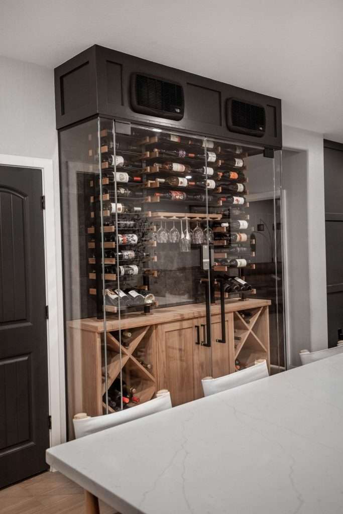 Wine cellar in dining room made with custom glass