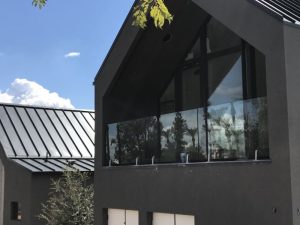 Deck Railing with Glass Vice on house
