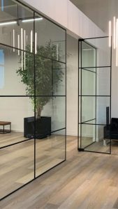 Grid wrapped glass partition