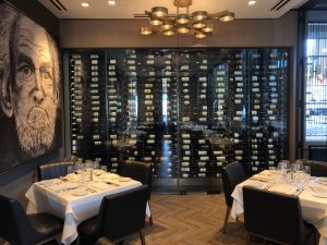 Wine Cellars - black - matte black - clear(18) Elegant restaurant with wine display and table settings