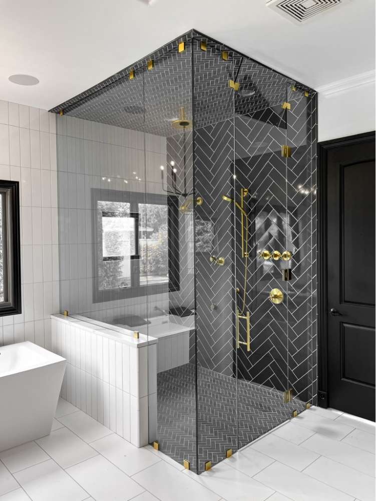 Shower in a bathroom with frameless glass
