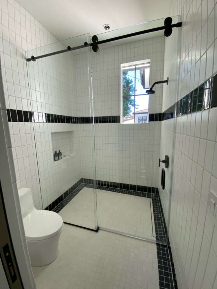 Shower in a bathroom with frameless glass
