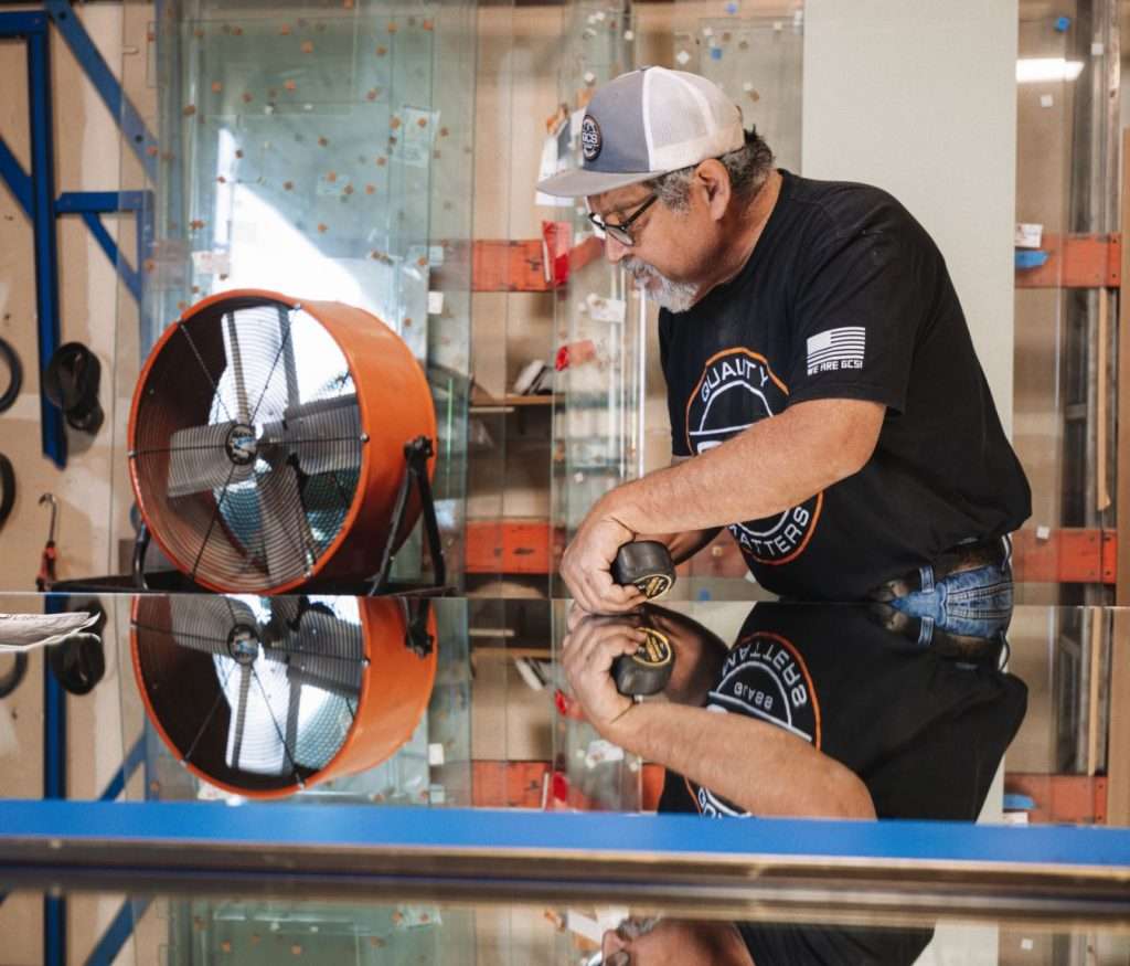 worker measuring glass