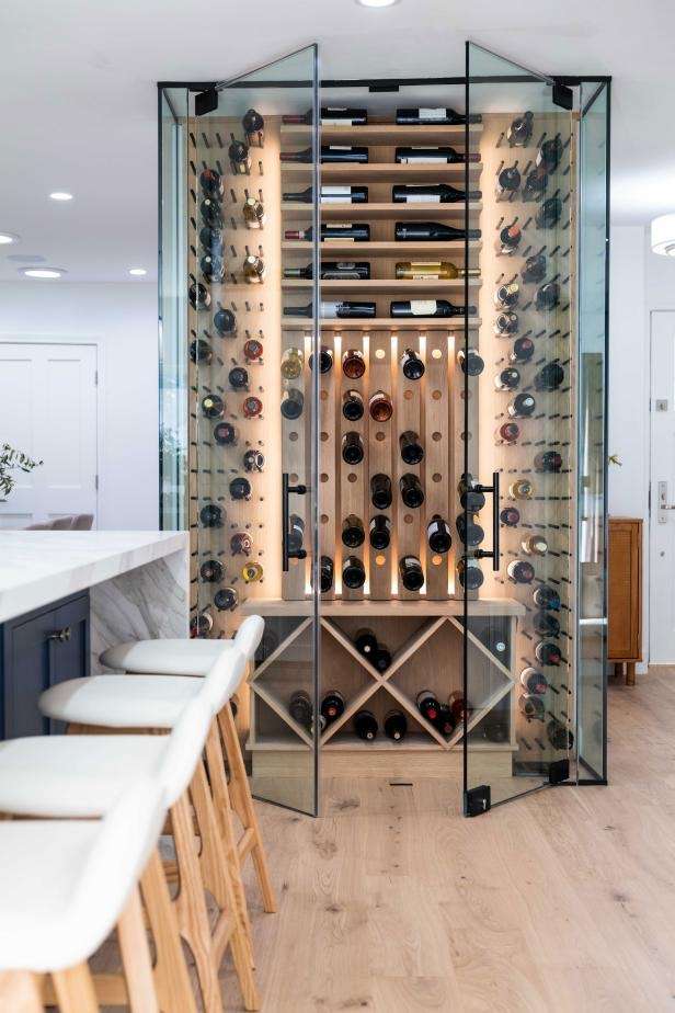 Residential glass wine cellar with brown tile and matte black